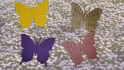 4 3D Printed Articulating Butterfly over a group of flowers