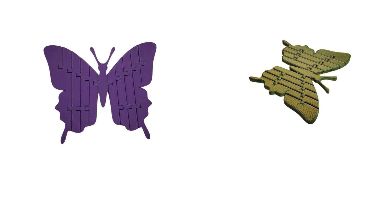 Two butterfly-shaped objects, one purple and one green, on a white background.