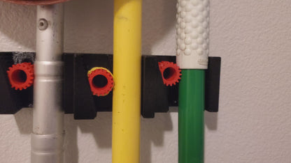 Wall Mounted Gravity Broom holder. Broom/Mop other tools holder for organization