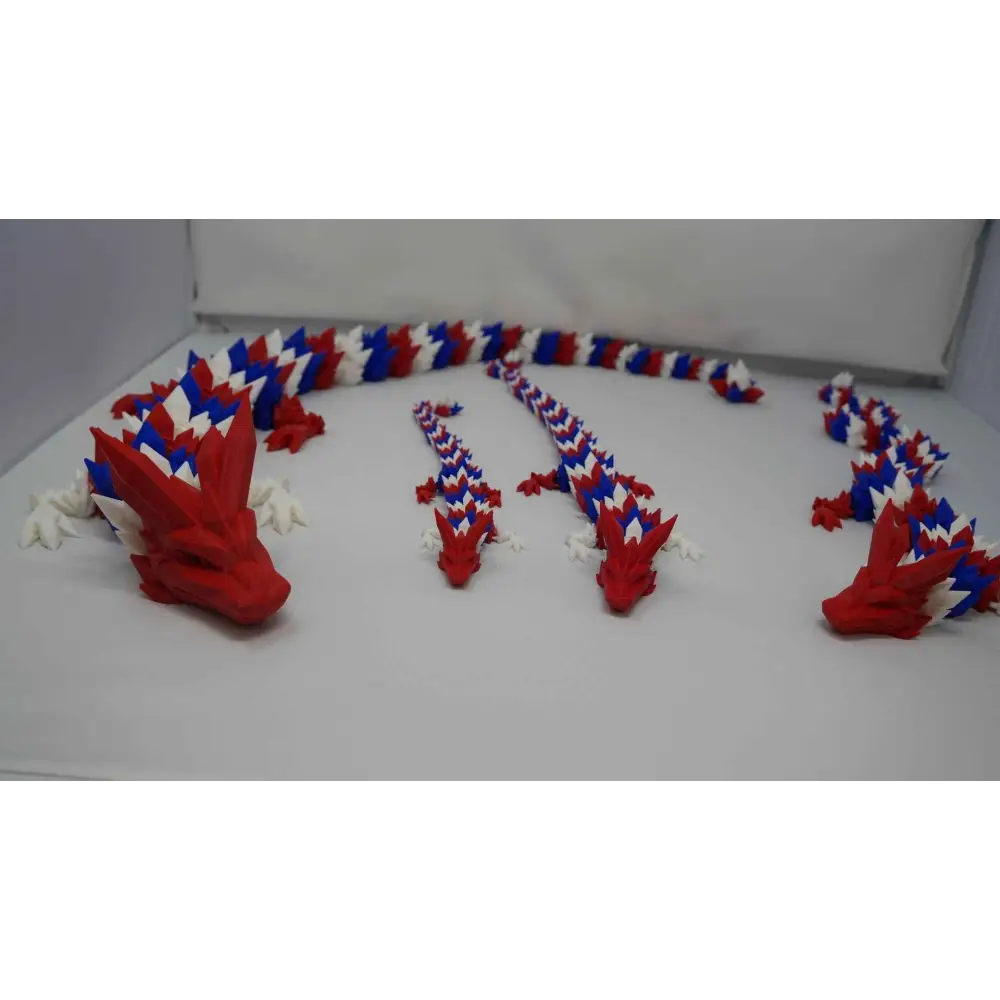 Red white and blue articulated Dragon, 3D printed dragon fidget toy with movable head, legs, and body segments