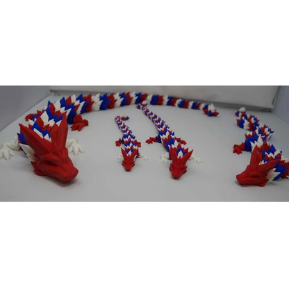 Red white and blue articulated 3D printed dragon fidget toy with movable head, legs, and body segments